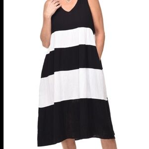 The Tulip Clothing VCG509 Stella Dress is a sleeveless, tiered dress featuring a